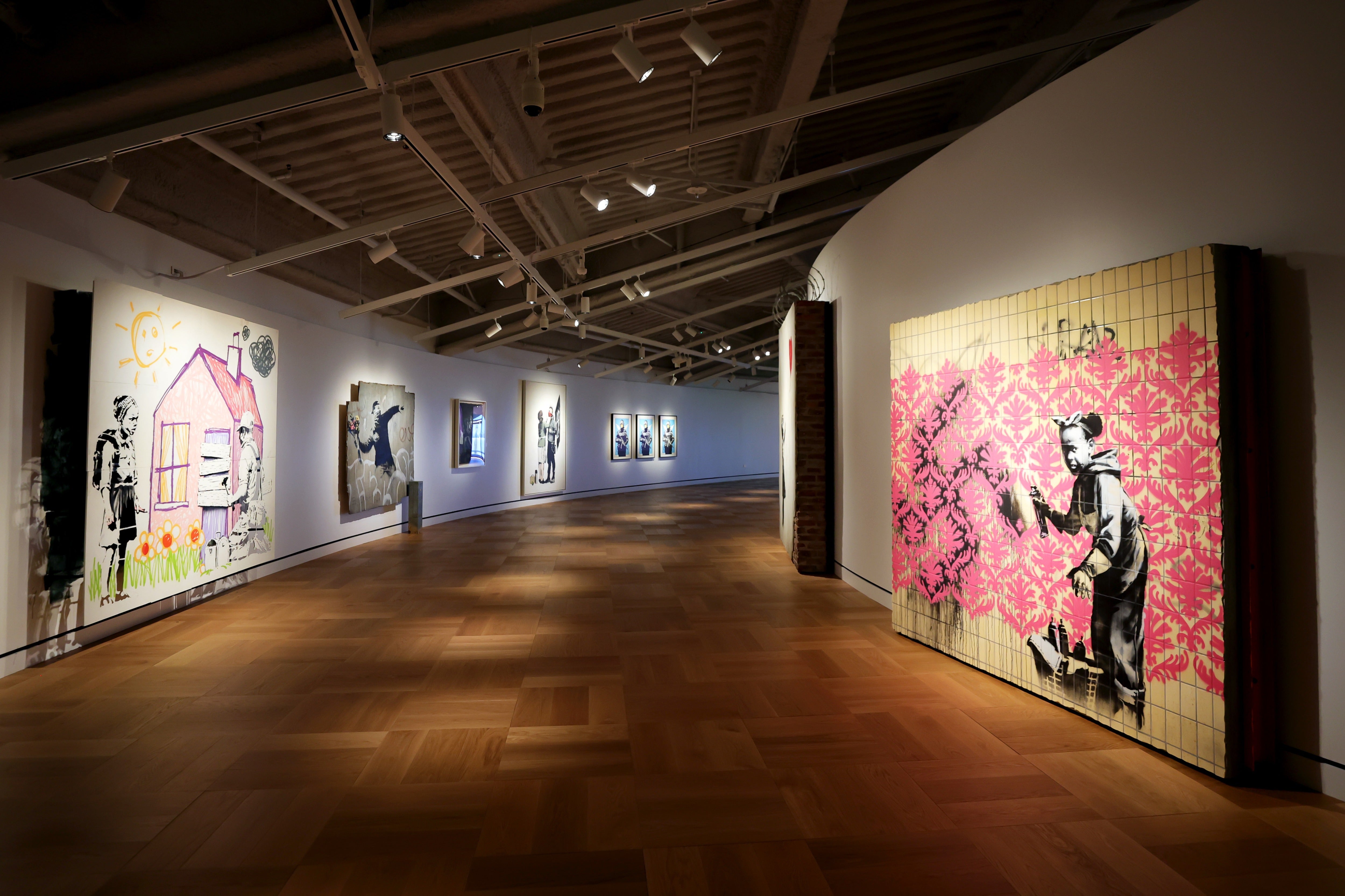 British street artist Banksy personally installed his work in a gallery dedicated to murals at the Lucas Museum of Narrative Art