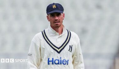 Nathan Gilchrist in Warwickshire cable-knit jumper and cap