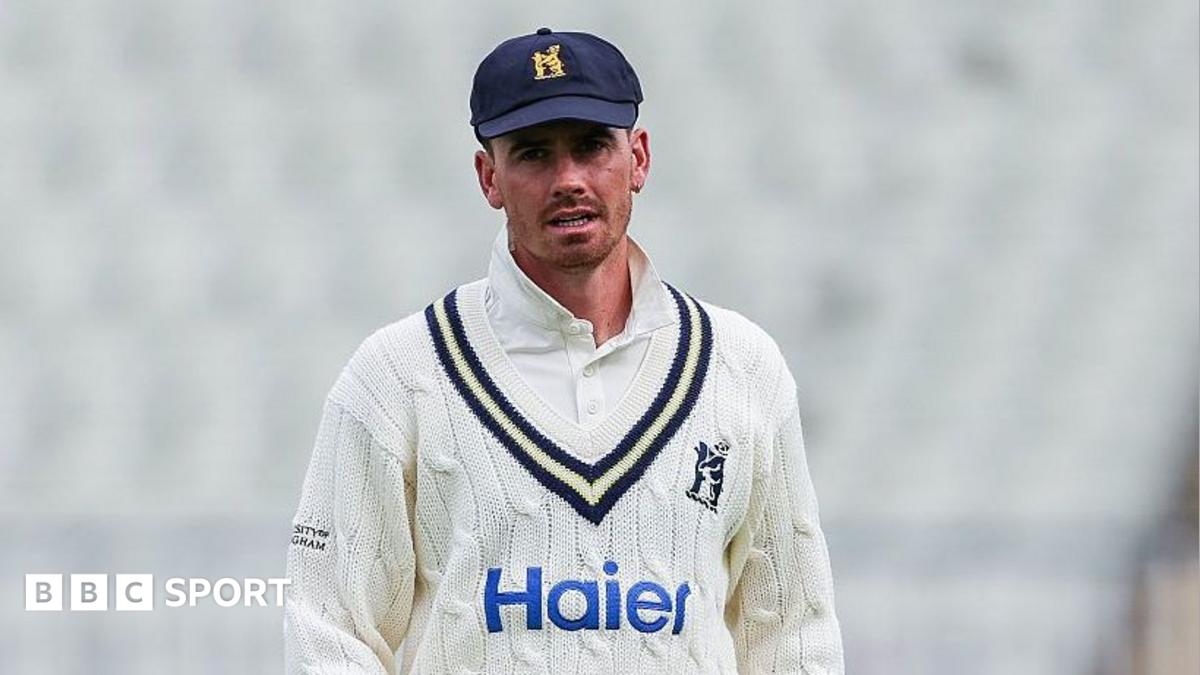 Nathan Gilchrist in Warwickshire cable-knit jumper and cap