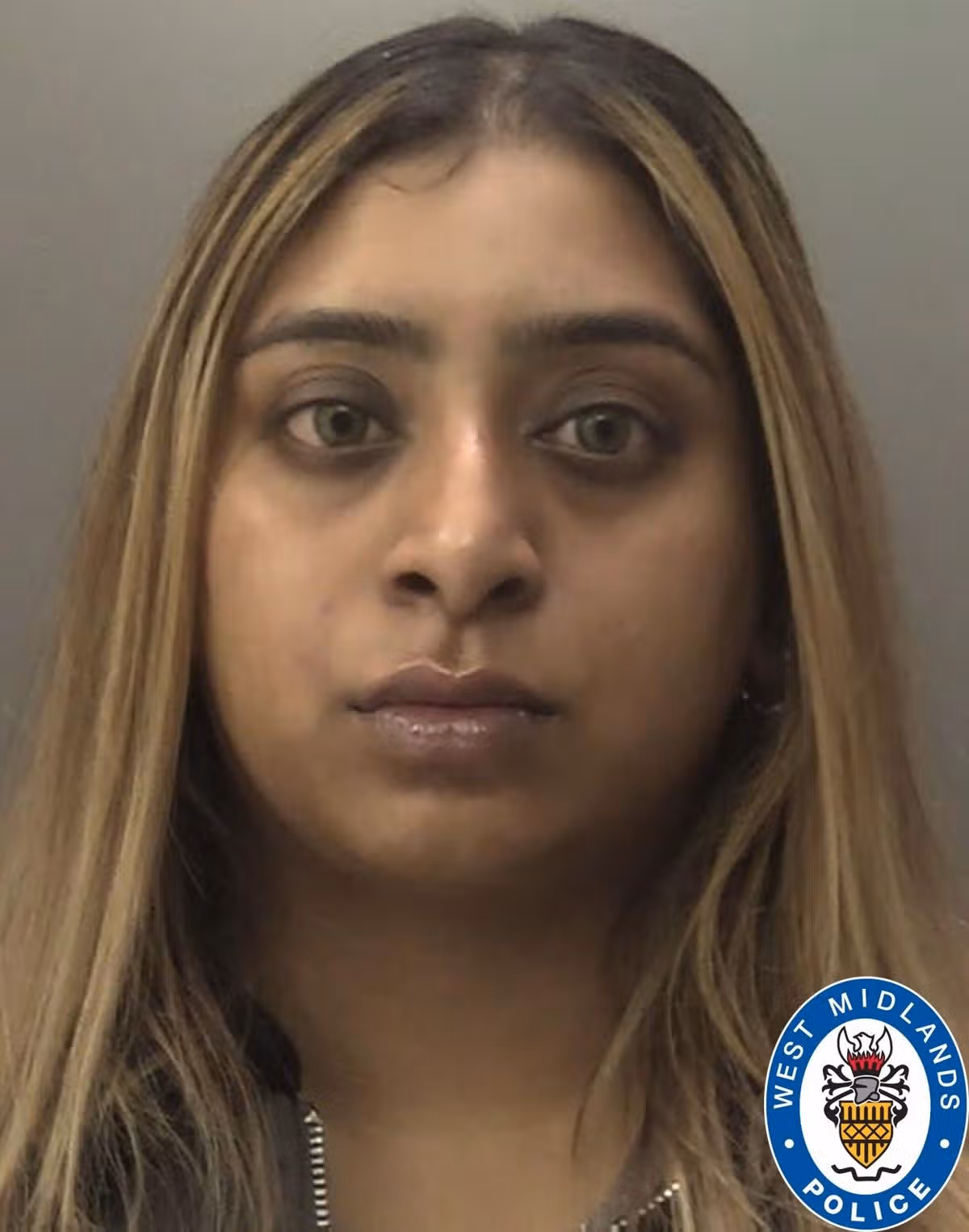 Police custody image of Shanise Hussain of West Drive, Handsworth who is Asian and has dark hair with blonde streaks