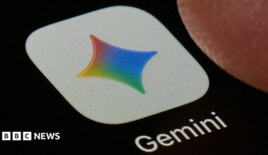 A close-up shot of the Gemini application on a black screen. The icon is a white square with a four-point star in Google's colours, under which the word 'Gemini' is printed.