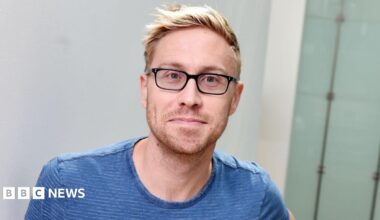 Russell Howard pictured at the BBC's New Broadcasting House, wearing a blue T-shirt