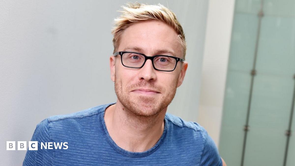 Russell Howard pictured at the BBC's New Broadcasting House, wearing a blue T-shirt