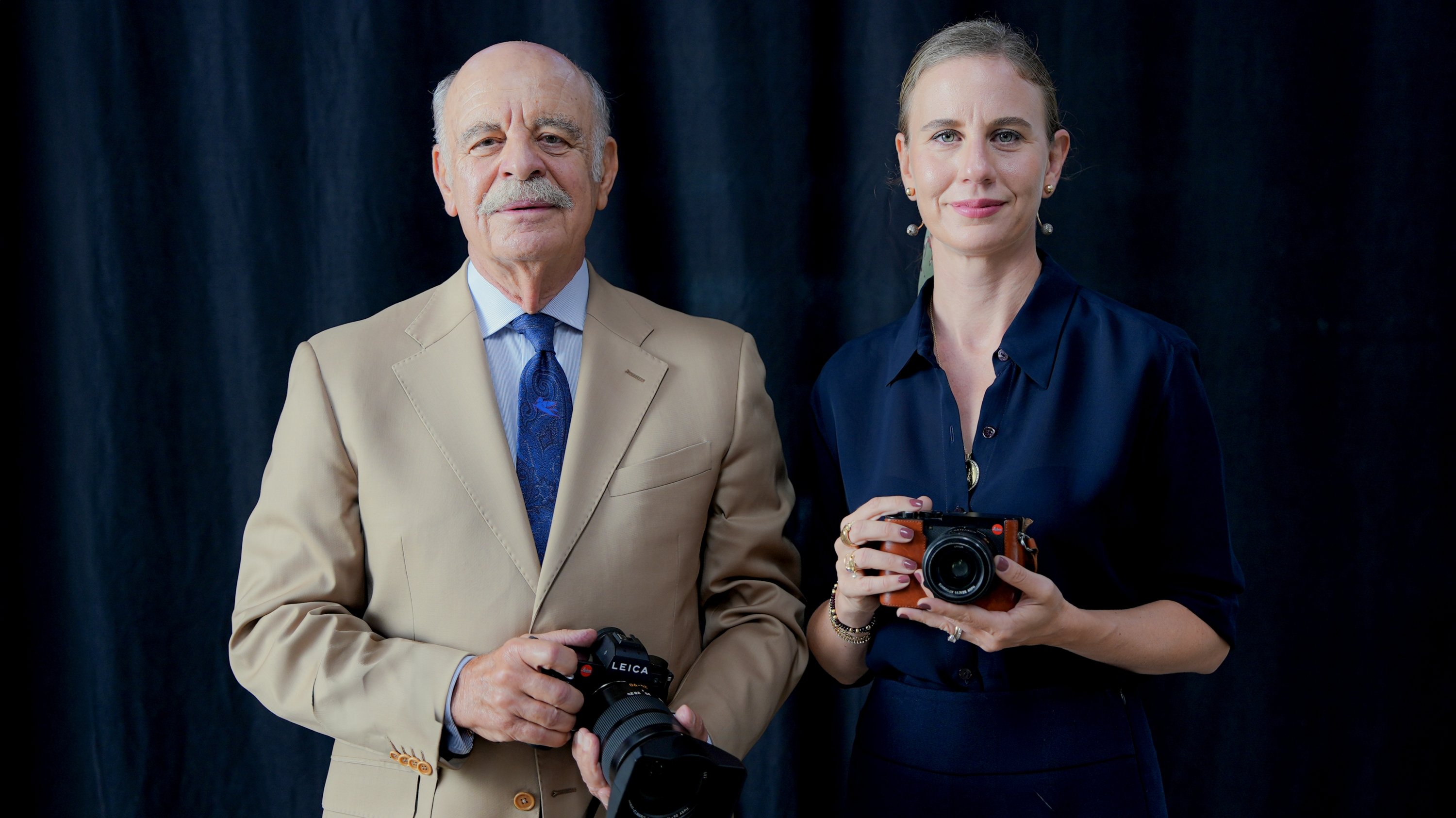 Mehmet H. Erbak (L) and Ceylin Erbak Aytekin poses together with their cameras. (Photo courtesy of Derya Taşbaşı)