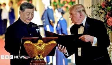 US President Donald Trump holds a binder as he stands next to Chinese President Xi Jinping before Xi delivers a speech during a state dinner at the White House in Washington, D.C., US, September 24, 2026.