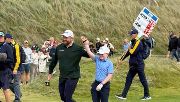 Athenry's Cillian Hirst with newly minted Amgen Irish Open champion Shane Lowry at Doonbeg.