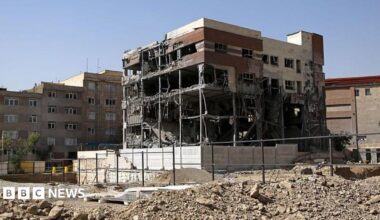 General view of a five-storey building in Tehran. The building has been shelled-out by a reported missile attack, the outer brickwork is no longer visible and instead the building is hollowed out but is still standing. It is surrounded by rubble