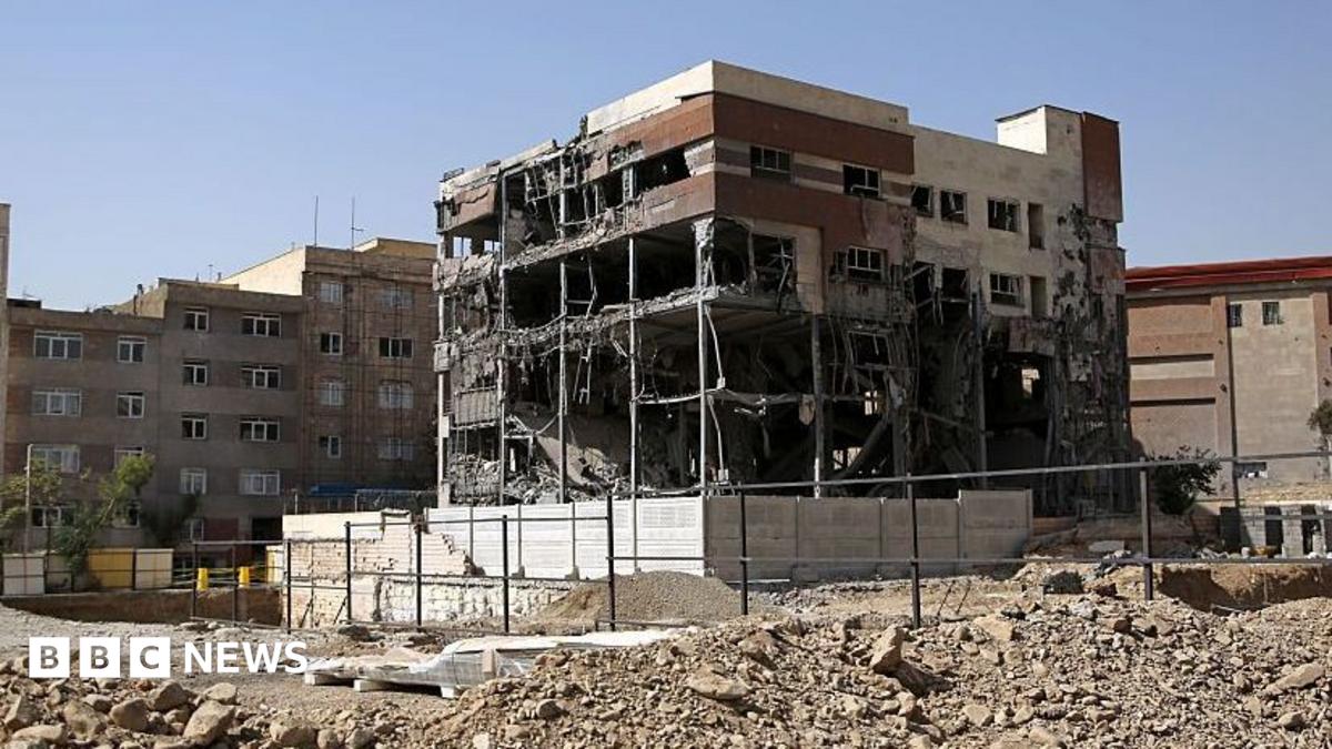 General view of a five-storey building in Tehran. The building has been shelled-out by a reported missile attack, the outer brickwork is no longer visible and instead the building is hollowed out but is still standing. It is surrounded by rubble
