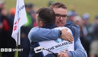Eliot Baker hugs his caddie