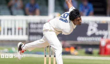 Hasan Mahmud, in Kent whites, bowling