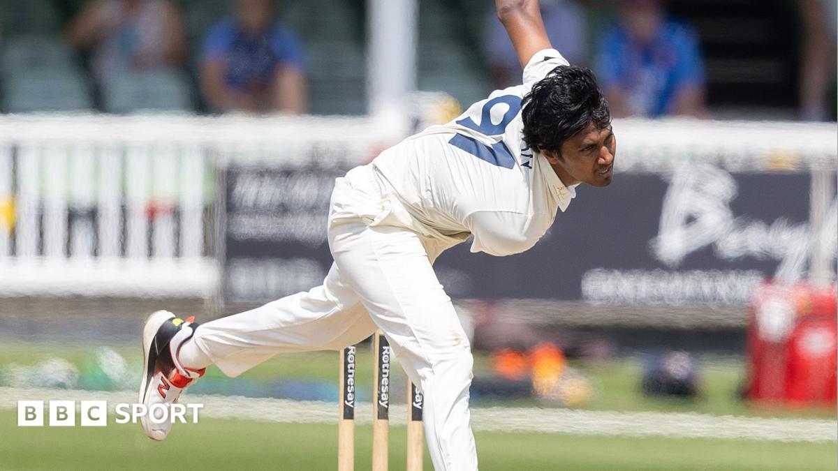 Hasan Mahmud, in Kent whites, bowling