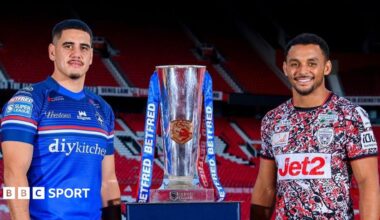 Wakefield boss Daryl Powell (left) and owner Matt Ellis (right) stand with their arms aloft in celebration