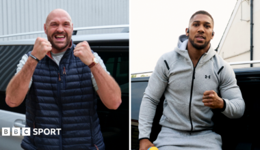 Tyson Fury and Anthony Joshua getting out of their respective cars in London