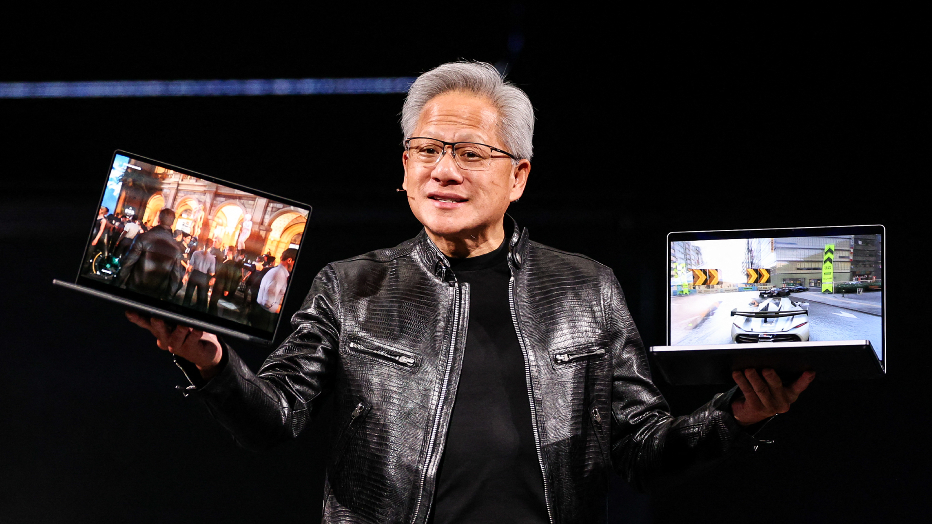 Nvidia CEO Jensen Huang introduces the RTX Spark laptop during his keynote speech at Computex 2026 in Taipei on June 1, 2026. Nvidia unveiled a powerful laptop chip for Windows machines on June 1, staking its claim in the market for next-generation consumer PCs integrated with artificial intelligence. (Photo by I-Hwa Cheng / AFP via Getty Images)