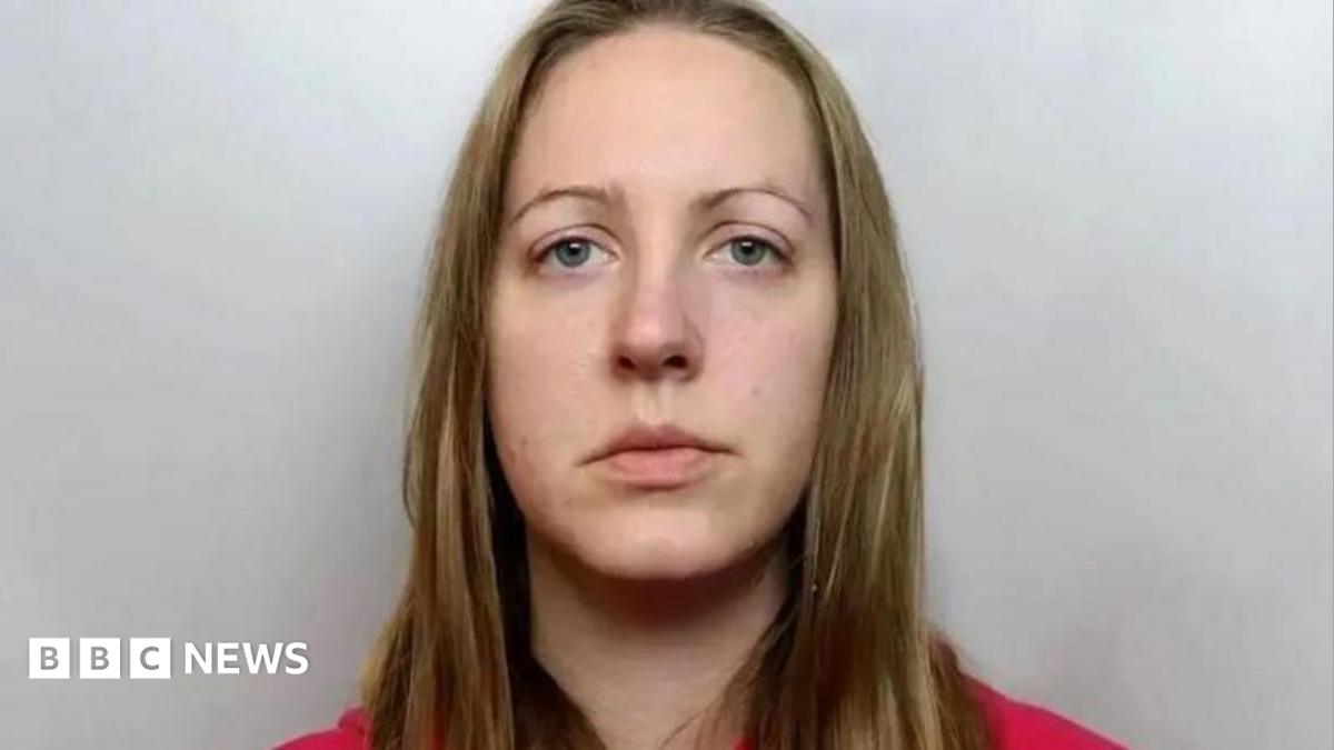 Custody image of Lucy Letby, who has long blonde hair and is wearing a red top.