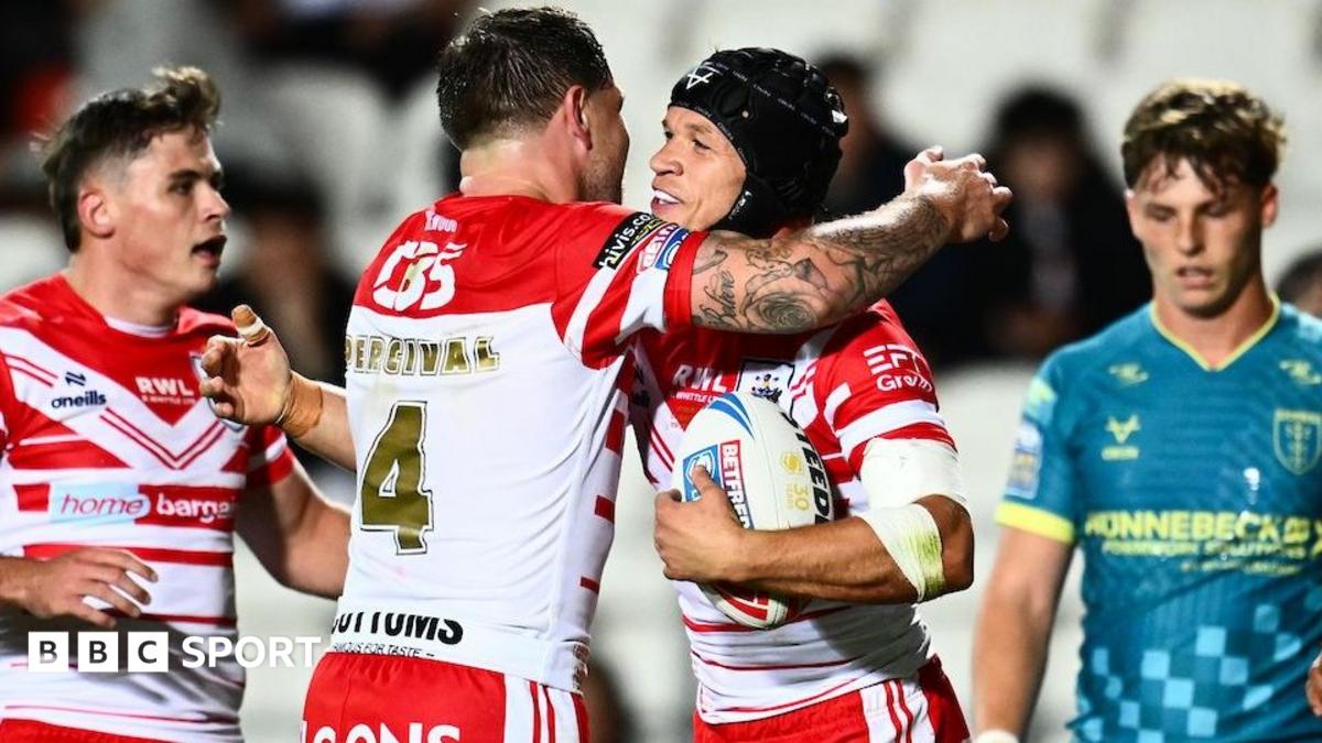 St Helens' Mark Percival embraces try scorer Jonny Lomax after setting up his old friend to score against Hull KR.