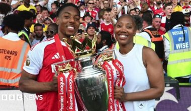 Marcia and Myles with the Premier League trophy