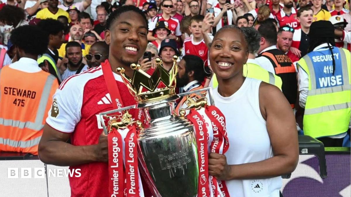 Marcia and Myles with the Premier League trophy