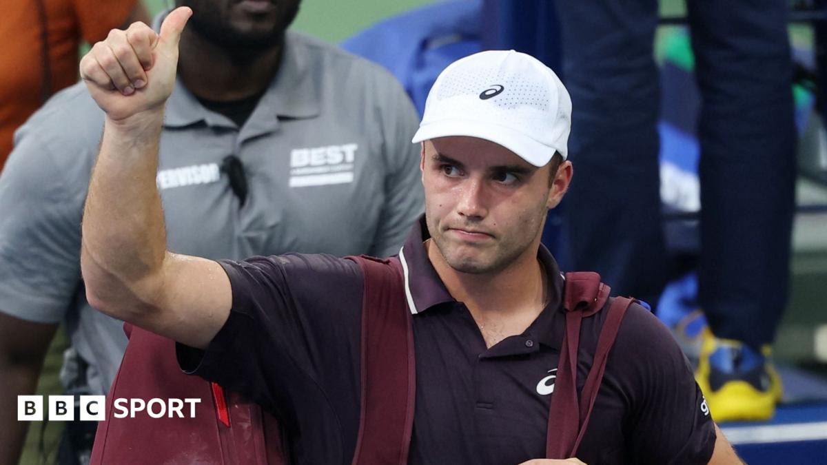 Arthur Fery thanks the crowd as he leaves the court following his defeat at the US Open