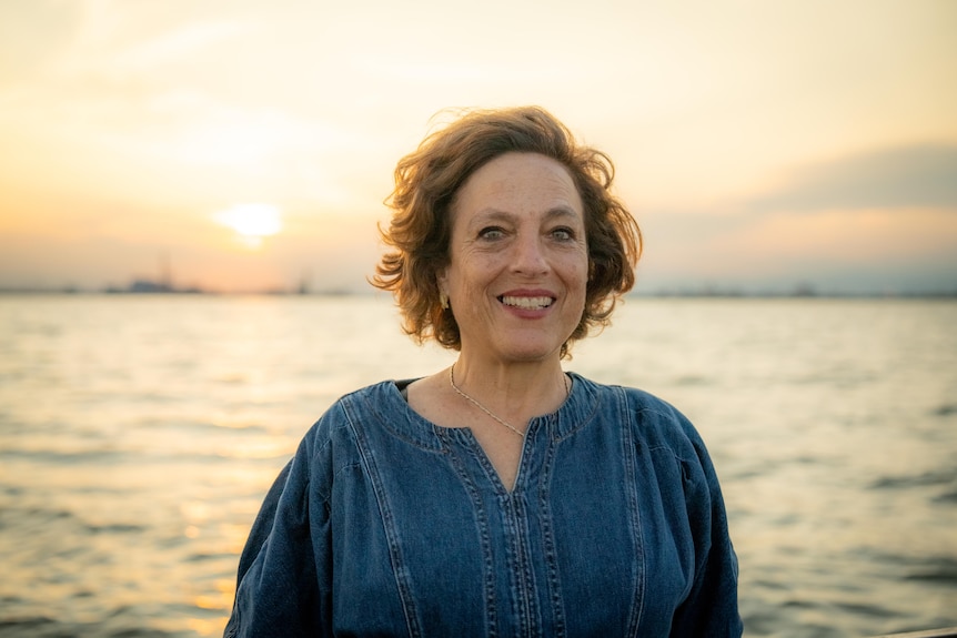 A woman in front of Venice lagoon.