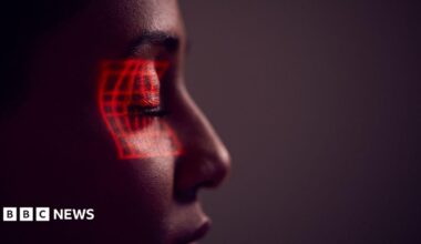 Facial Recognition Technology Concept As Woman Has Red Grid Projected Onto Eye In Studio
