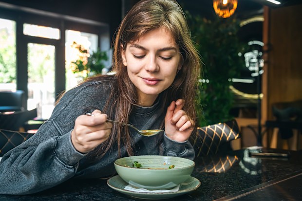 Stock image of a woman eating