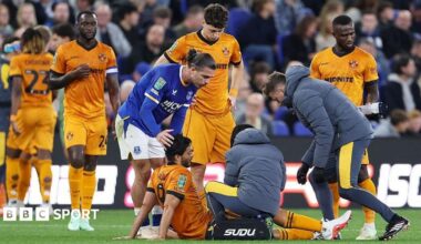 Raul Jimenez sits on the floor getting treatment on his left leg in Wolves' 1-0 Carabao Cup defeat by Everton at the Hill Dickinson Stadium (16 September 2026)