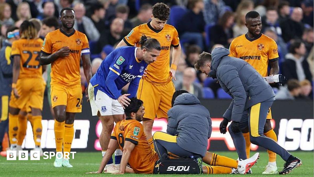 Raul Jimenez sits on the floor getting treatment on his left leg in Wolves' 1-0 Carabao Cup defeat by Everton at the Hill Dickinson Stadium (16 September 2026)
