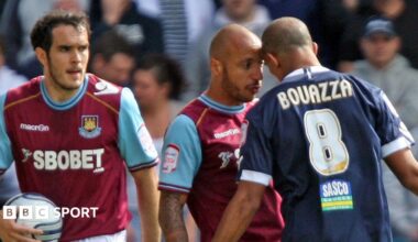 Two players put their heads against each other
