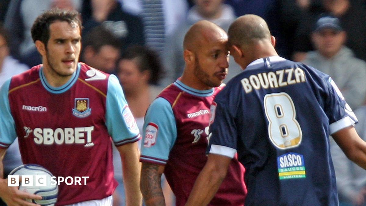 Two players put their heads against each other