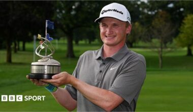 Sandy Scott with the  the Nationwide Children's Hospital Championship trophy