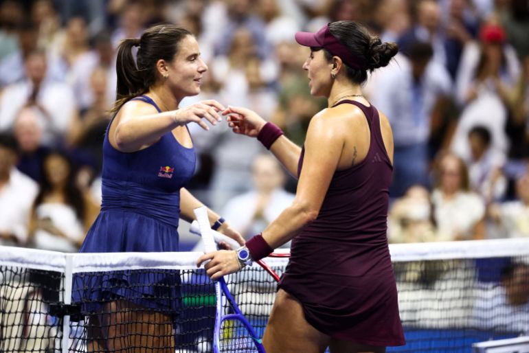 USA's Jessica Pegula (R) is congratulated by USA's Emma Navarro after winning their women's singles quarter-final tennis match on day ten of the US Open tennis tournament at the USTA Billie Jean King National Tennis Center in New York City on September 8, 2026. (Photo by CHARLY TRIBALLEAU / AFP)