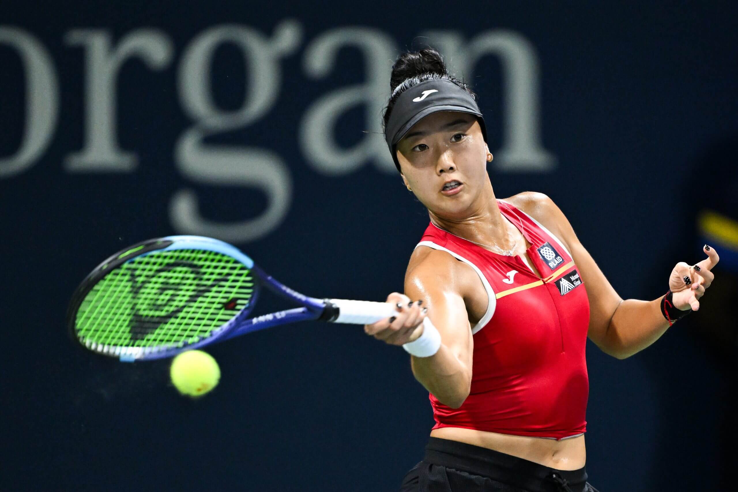 Ann Li hits a forehand as she looks forward.