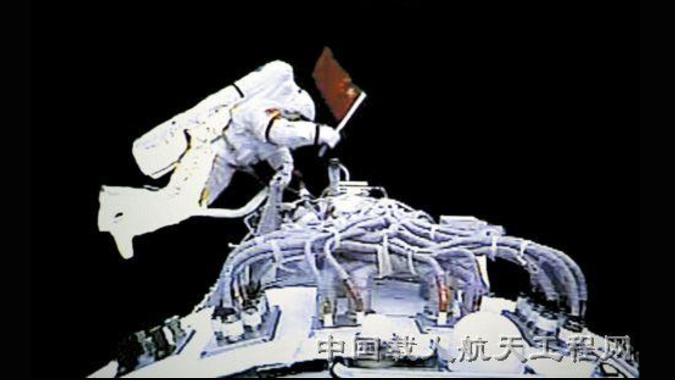 A Chinese astronaut waves a Chinese flag during the country's first spacewalk on the Shenzhou 7 mission in September 2008.
