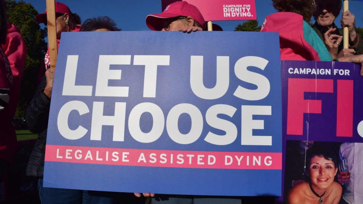 LONDON, UNITED KINGDOM - 2025/09/12: A protester holds a 'Let us choose' placard during the demonstration. Campaigners from the group Dignity In Dying and supporters of the Assisted Dying Bill gathered in Parliament Square as the bill was debated in the House of Lords. The bill would allow eligible terminally ill people to end their lives. (Photo by Vuk Valcic/SOPA Images/LightRocket via Getty Images)