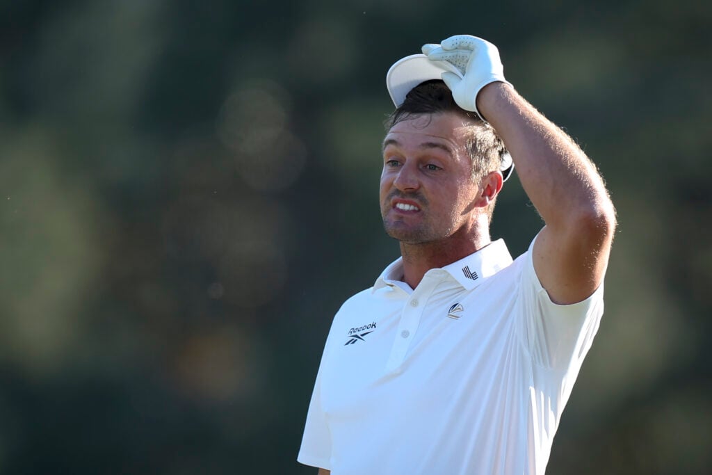 Bryson DeChambeau of the United States reacts on the 18th green during the second round of the 2026 Masters Tournament at Augusta National Golf Club
