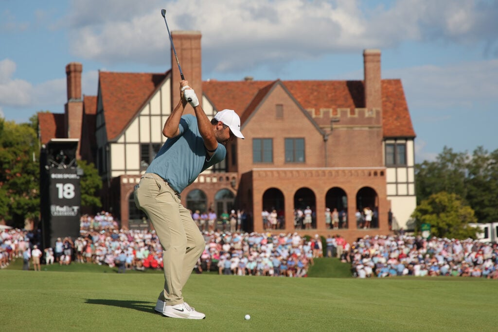 Scottie Scheffler hits his approach into the 18th hole at East Lake during the final round of the Tour Championship