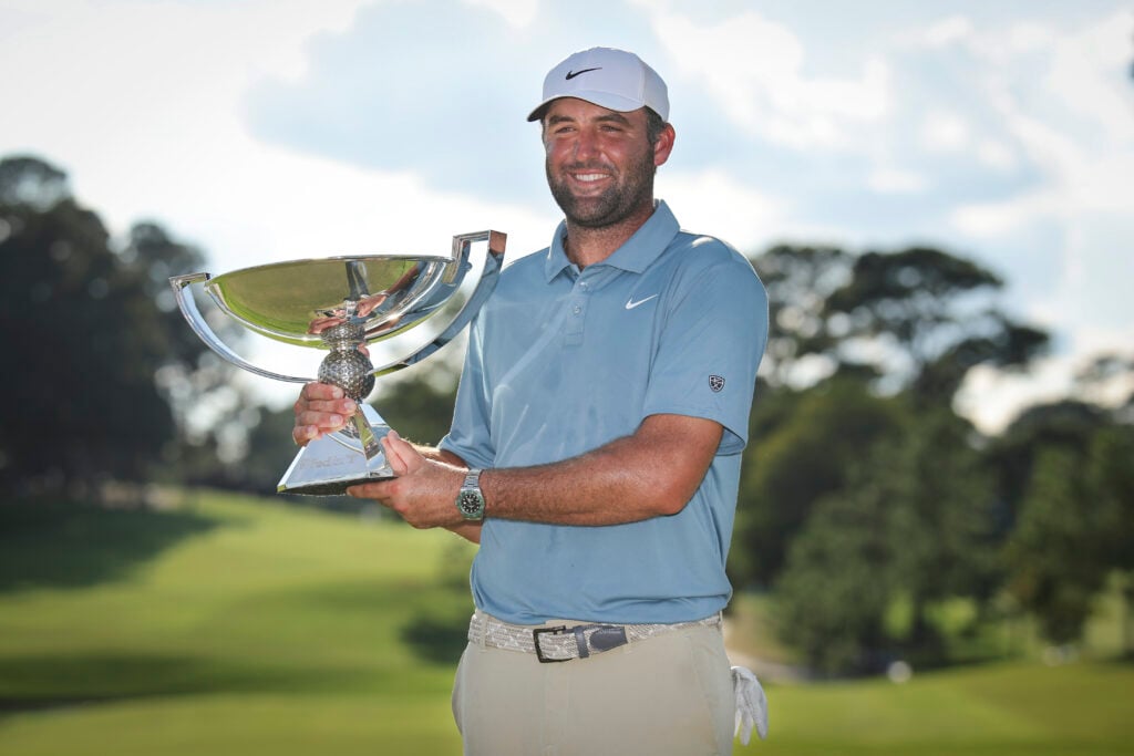 Scottie Scheffler holds aloft the TOUR Championship trophy