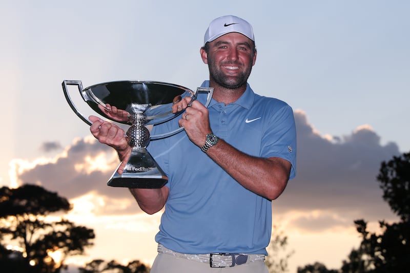 Scottie Scheffler of the United States poses with the trophy after winning the final round of the Tour Championship at East Lake. Photograph: Kevin C Cox/Getty