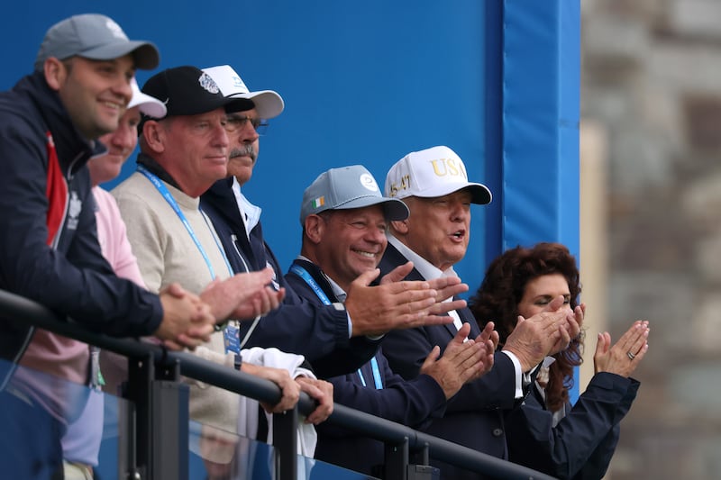 CLARECASTLE, IRELAND - SEPTEMBER 12: U.S. President Donald Trump applauds as he looks across the 18th green on day three of the Amgen Irish Open at Trump International Golf Links in Doonbeg on September 12, 2026 in Clarecastle, Ireland. (Photo by Richard Heathcote/Getty Images)