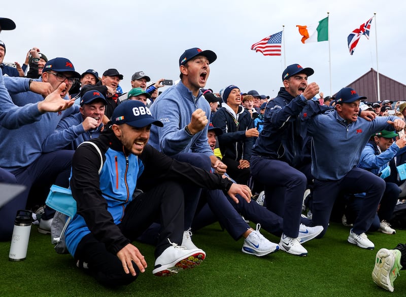 Great Britain & Ireland players celebrate  the winning putt at Lahinch Golf Club. Photograph: Ben Brady/Inpho