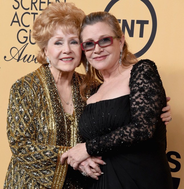 LOS ANGELES, CA - JANUARY 25: Honoree Debbie Reynolds (L) and actress Carrie Fisher pose in the press room at the 21st Annual Screen Actors Guild Awards at The Shrine Auditorium on January 25, 2015 in Los Angeles, California. (Photo by Steve Granitz/WireImage)