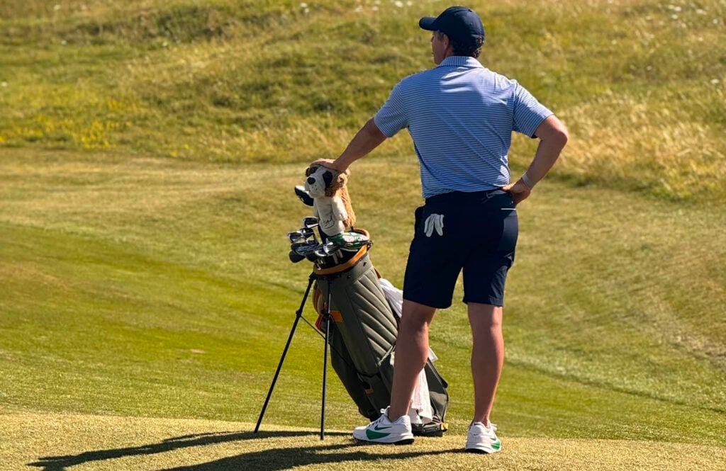 Rory McIlroy leans on his carry bag during his day at St Enodoc | Source: Tim Cowley

Rory McIlroy at St Enodoc