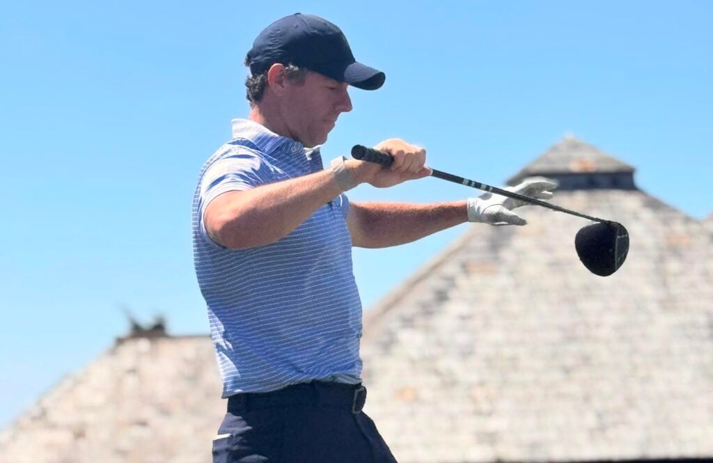 Rory McIlroy studies his driver while waiting to play at St Enodoc | Source: Tim Cowley

Rory McIlroy at St Enodoc