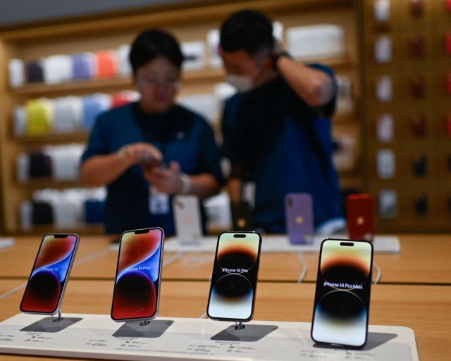 iPhone 14 models are displayed at an Apple store in Beijing on September 12, 2023. (Photo by Pedro PARDO / AFP) (Photo by PEDRO PARDO/AFP via Getty Images)
