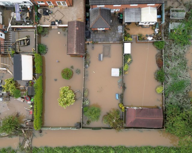RETFORD, UNITED KINGDOM - OCTOBER 23: In this aerial view gardens remain flooded as high water levels begin to recede after Storm Babet flooded homes, business and roads on October 23, 2023 in Retford, United Kingdom. The UK Environment Agency has warned that flooding could last for days in the wake of Storm Babet with 116 flood warnings remaining in place across England. (Photo by Christopher Furlong/Getty Images)