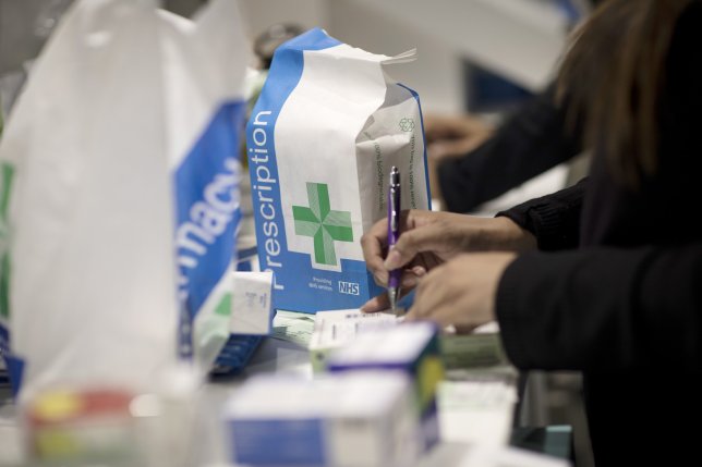 A pharmacist checks a prescription before dispensing medication at Hodgson Pharmacy in Longfield, Kent, U.K., on Tuesday, Feb. 5, 2019. Novo Nordisk A/S, the worlds biggest maker of insulin has reserved space on airplanes and is planning to boost stockpiles further to ensure diabetes patients in the U.K. dont run out of the life-saving medicine in the event of no-deal Brexit. Photographer: Simon Dawson/Bloomberg via Getty Images