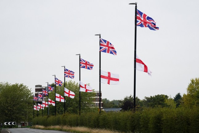 The flag of the United Kingdom and the Flag of St George hang from lamposts in Birmingham. Anti-immigration campaign groups have been flying and painting Union and St George's Cross flags as part of a UK-wide campaign called Operation Raise the Colours. Picture date: Sunday September 14, 2025. PA Photo. The widespread flying of flags has become contentious with some local authorities removing flags. Photo credit should read: Jacob King/PA Wire