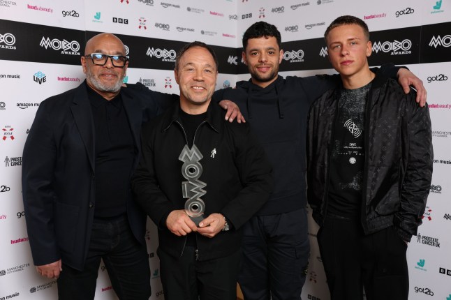 MANCHESTER, ENGLAND - MARCH 26: Stephen Graham and guests pose with the award for Best Performance in a TV Show/Film for Adolescence inside the winners' room during the 2026 MOBO Awards at Co-op Live on March 26, 2026 in Manchester, England. (Photo by Shane Anthony Sinclair/Getty Images for MOBO)
