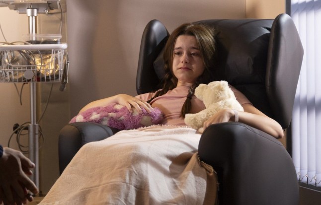 Betsy Swain sitting in a hospital armchair with a blanket over her lap in Coronation Street.